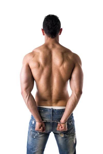 Back of muscular shirtless young man with handcuffs — Stock Photo, Image