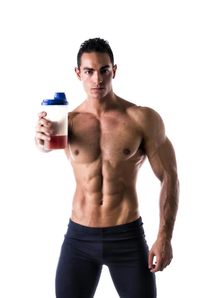 Muscular shirtless male bodybuilder holding protein shake bottle — Stock Photo, Image