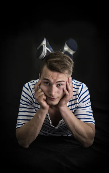 Handsome blond young man laying down — Stock Photo, Image