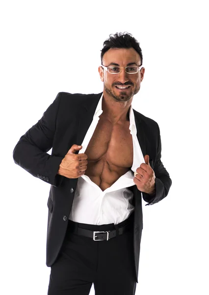 Businessman opening his shirt revealing muscular torso — Stock Photo, Image