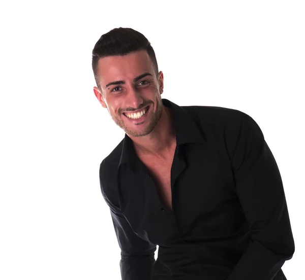 Smiling young man in black shirt, looking at camera — Stock Photo, Image