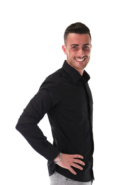 Smiling young man in black shirt, looking at camera — Stock Photo, Image