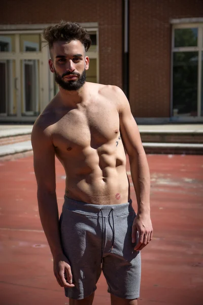 Handsome shirtless young man with beard — Stock Photo, Image