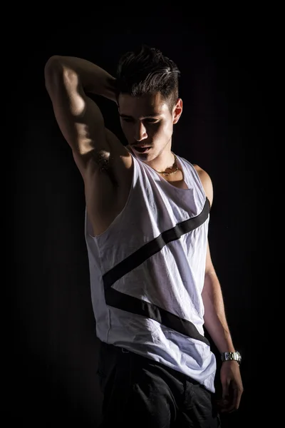 Portrait of handsome young man in white tank-top — Stock Photo, Image