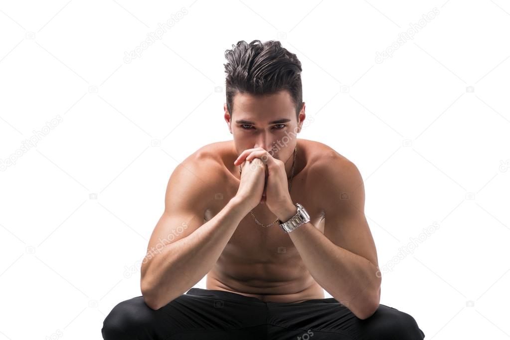 Shirtless man deep in contemplation