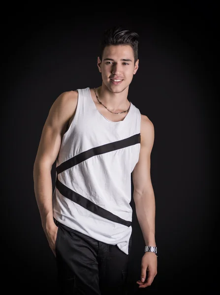 Portrait of friendly young man smiling in white tank-top — Stock Photo, Image