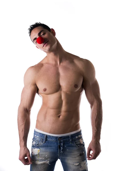 Red clown nose on muscular man — Stock Photo, Image