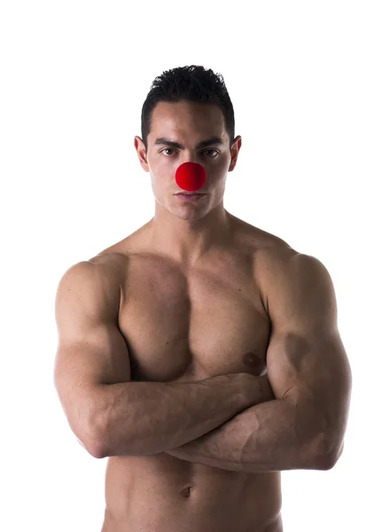Red clown nose on muscular man — Stock Photo, Image