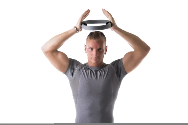 Man exercising with Pilates ring — Stock Photo, Image