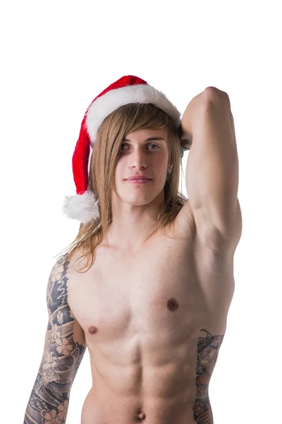 Man with tattoo wearing Santa Clause hat —  Fotos de Stock