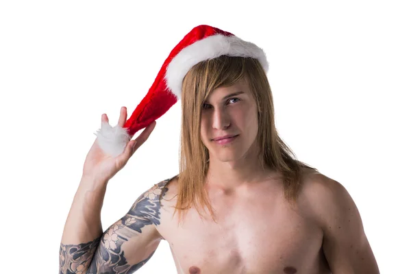 Man with tattoo wearing Santa Clause hat — Stock Photo, Image