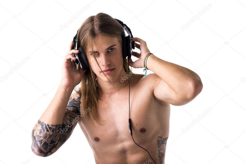 Man shirtless listening to music