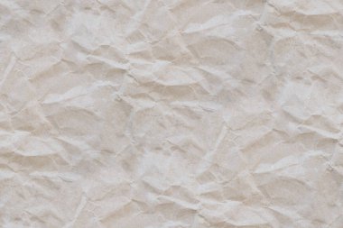 Eskimiş kağıt dokusu. Boş arkaplanı özetle. Bej rengi grunge geri dönüşümlü kramplı yatay sayfa. Tekstil, kumaş, duvar kağıdı, ambalaj kağıdı baskısı. Boşluğu kopyala.