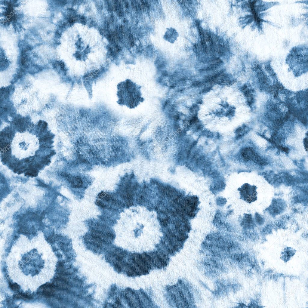 Tie dye shibori seamless pattern. Abstract tie-dye technique hand dyed fabric. Indigo blue navy circles elements on white background. Abstract texture. Print for textile, wallpaper, wrapping paper.
