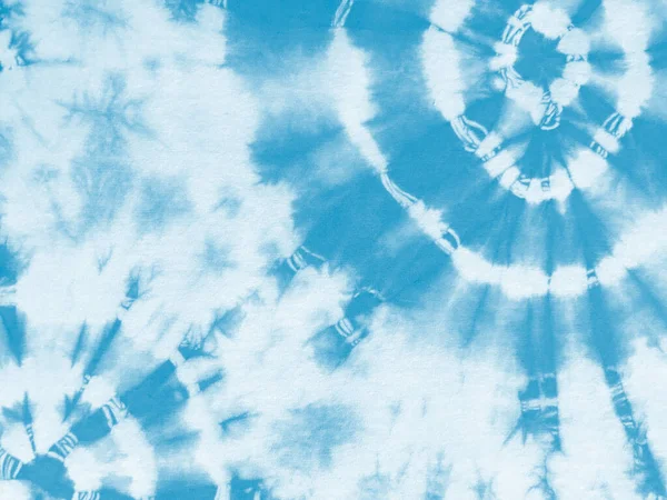 Tie dye shibori pattern. Abstract tie-dye technique hand dyed fabric. Turquoise blue teal ornamental circles elements on white background. Abstract texture.