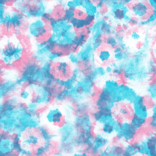 Tie dye shibori seamless pattern. Abstract tie-dye technique hand dyed fabric. Pink teal flower circles elements on white background. Abstract texture. Print for textile, wallpaper, wrapping paper.