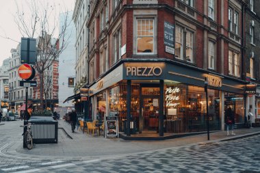 London, UK - November 23, 2021: Prezzo restaurant on a street in Soho, an area of London famous for its bars, restaurants and clubs. Prezzo is a chain of British-owned restaurants in UK and Ireland.