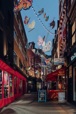 London, UK - November 23, 2021: Butterflies Christmas decorations around Carnaby Street as a part of Christmas installation in collaboration with charity partner Choose Love.