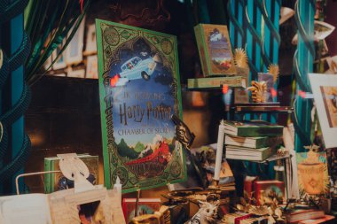 London, UK - November 23, 2021: Harry potter books in the window of MinaLima, the design studio behind the graphic props of the Harry Potter and Fantastic Beasts films, in Covent Garden, London.