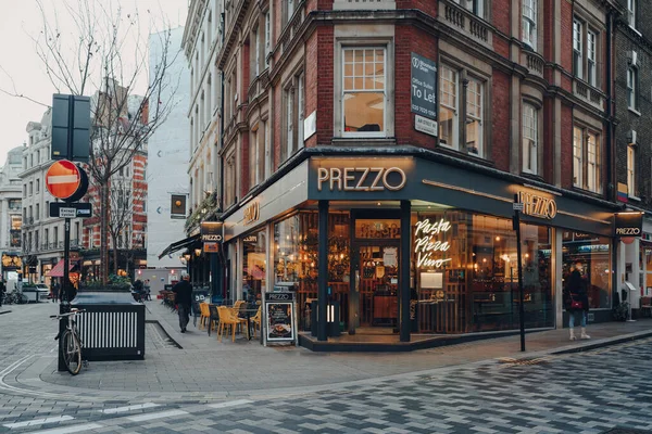 London, UK - November 23, 2021: Prezzo restaurant on a street in Soho, an area of London famous for its bars, restaurants and clubs. Prezzo is a chain of British-owned restaurants in UK and Ireland.