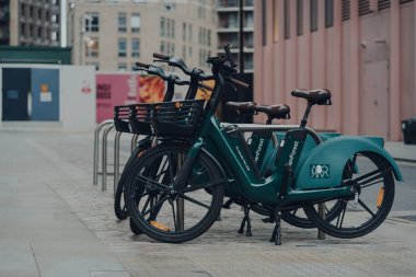 London, UK - January 01, 2022: Human Forest bikes parked on a street in London. The bikes are built with sustainability at their core and are available in selected London boroughs from summer 2021.