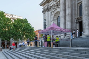 London, UK - August 26, 2022: Visitors go through security bag check before entering St. Pauls Cathedral, the cathedral of the Bishop of London.