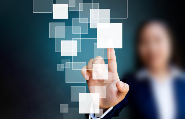 hand of business women pushing a button on a touch screen interf