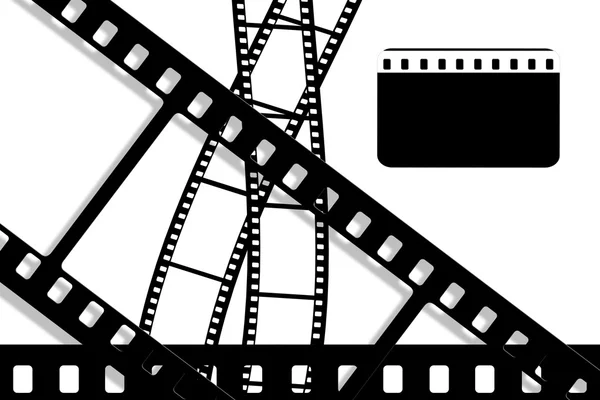 Böjda svart film blad på vit bakgrund — Stockfoto