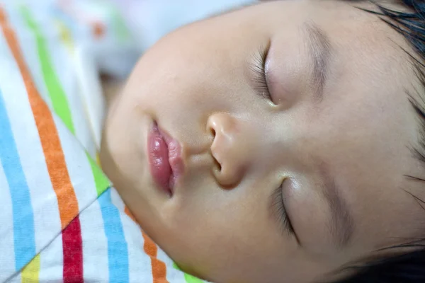 Asian newborn baby lying on bed — Stock Photo, Image