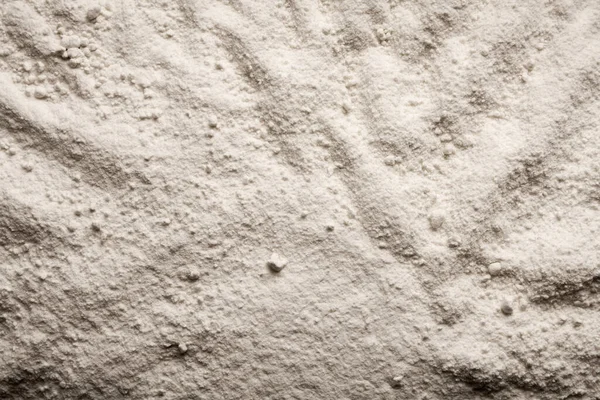 Soyut dikişsiz desenli beyaz granüler malzeme arka planı.