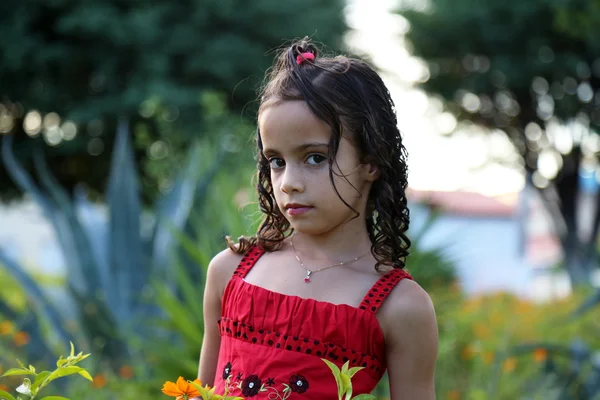 Beautiful child in red dress — Stock Photo, Image
