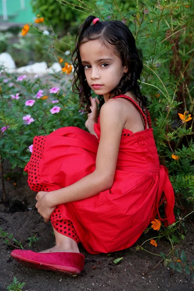 Beautiful child in red dress — Stock Photo, Image