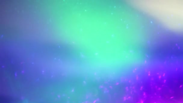 Loopable spectral iridescent overlay. Surrealistic holographic light leaks. Light glowing in dark space. — Stock Video