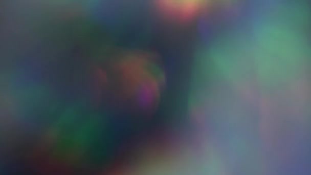 Abstract blinking bokeh iridescent background. Seamless footage. — Wideo stockowe