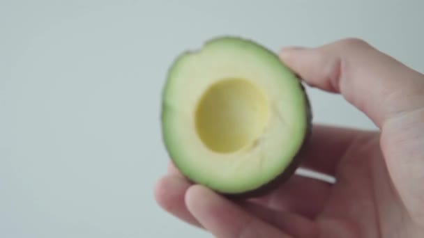 Hands Divide Ripe Avocado Two Halves White Background Footage — Stock Video
