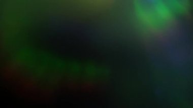 Yanardöner çoklu renkli odağını kaybetmiş ışık soyut efekt arkaplanı sızdırır. Yavaş hareket eden lens zarif bokeh, 4k görüntü.