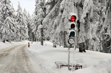 Traffic lights on the winter road in mountain Klínovec