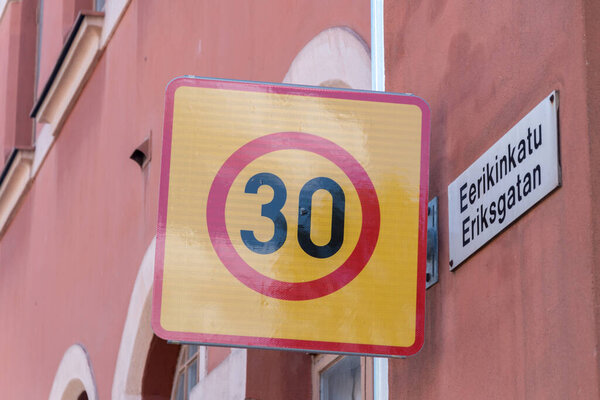 Sign 30 km per hour speed limit zone traffic in Finland.