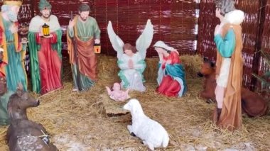 Deblin, Poland - December 26, 2021: Close-up on sculpture of the baby Jesus Christ at Christian tradition, a nativity scene.