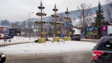 Zakopane, Poland - December 29, 2021: Traffic on Roman Dmowski roundabout.