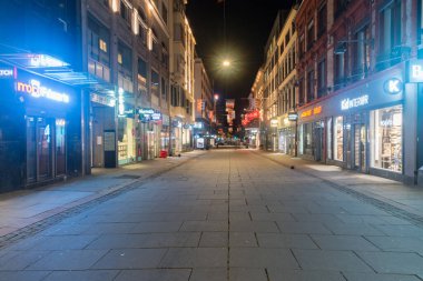 Oslo, Norway - September 24, 2021: Night view on Torggata shopping street in downtown of Oslo.