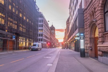 Oslo, Norway - September 24, 2021: Street view in city centre with beautiful sunrise in Oslo.