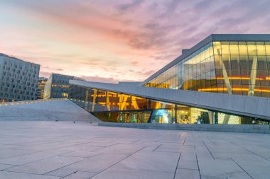 Oslo, Norway - September 24, 2021: National Oslo Opera House shines at sunrise.