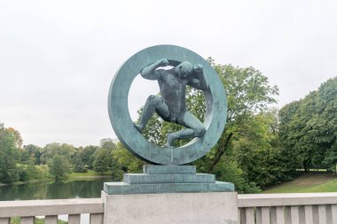 Oslo, Norway - September 24, 2021: Sculpture of a man in the ring in Vigeland park.