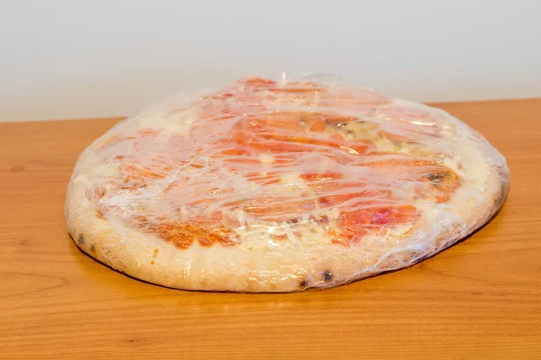 Foil Frozen Pizza Wooden Table — Stock Photo, Image