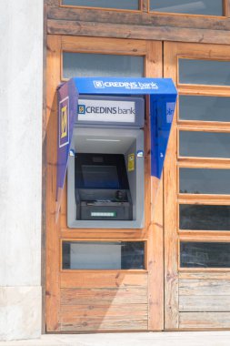 Tirana, Albania - June 4, 2022: ATM of Credins bank.