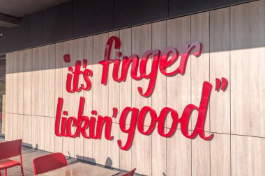 Pristina, Kosovo - June 5, 2022: It's finger lickin' good inscription. Promotion KFC slogan.