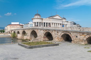 Skopje, North Macedonia - June 5, 2022: Stone Bridge over Vardar River in capital of North Macedonia.