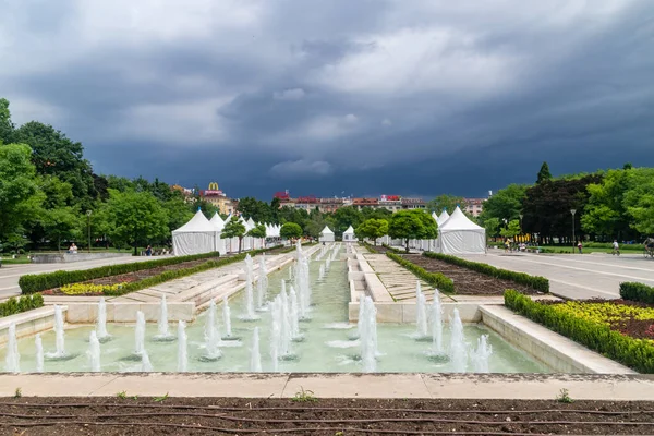 Sofia, Bulgaria - June 6, 2022: Fountains at National Palace of Culture (NDK) at cloudy day.