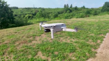 Gdanski, Poland - July 1, 2022: Dji Mavic Mini 2 static flying in the park.